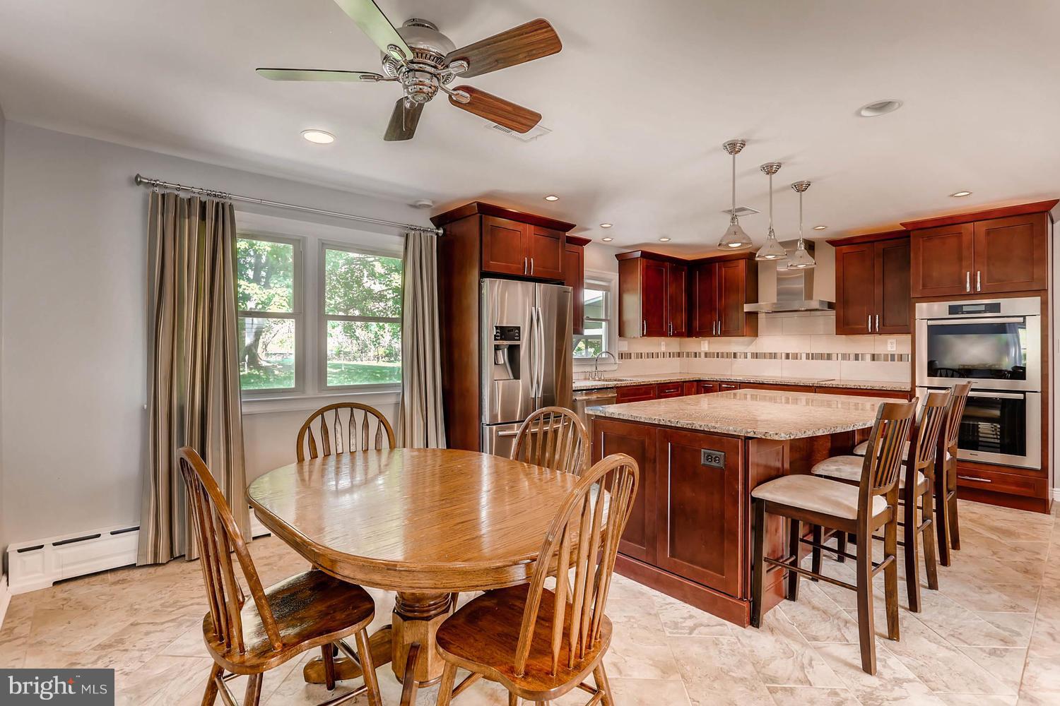14202 Sunburst Road Baldwin, MD 21013 - Photo 7 of 29 a view of a dining room with furniture window and wooden floor