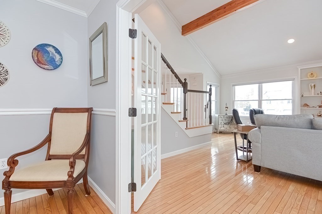 18 Carnation Circle, Unit B Reading, MA 01867 - Photo 15 of 42 a view of a livingroom with furniture and a window