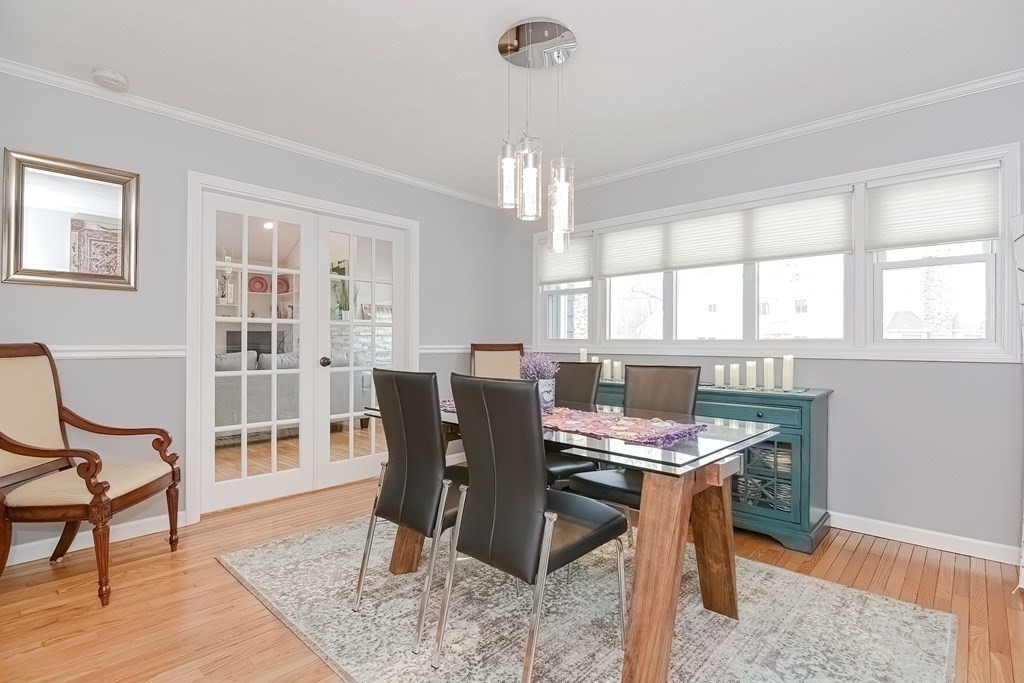 18 Carnation Circle, Unit B Reading, MA 01867 - Photo 16 of 42 a view of a dining room with furniture window and wooden floor