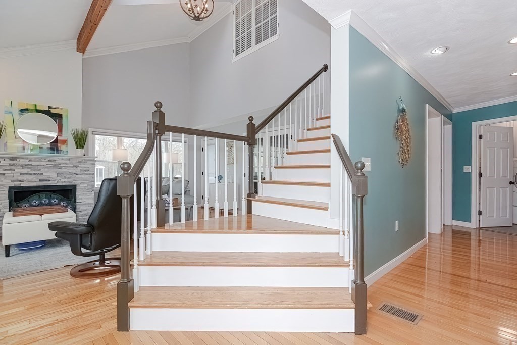 18 Carnation Circle, Unit B Reading, MA 01867 - Photo 22 of 42 a view of entryway and hall with wooden floor