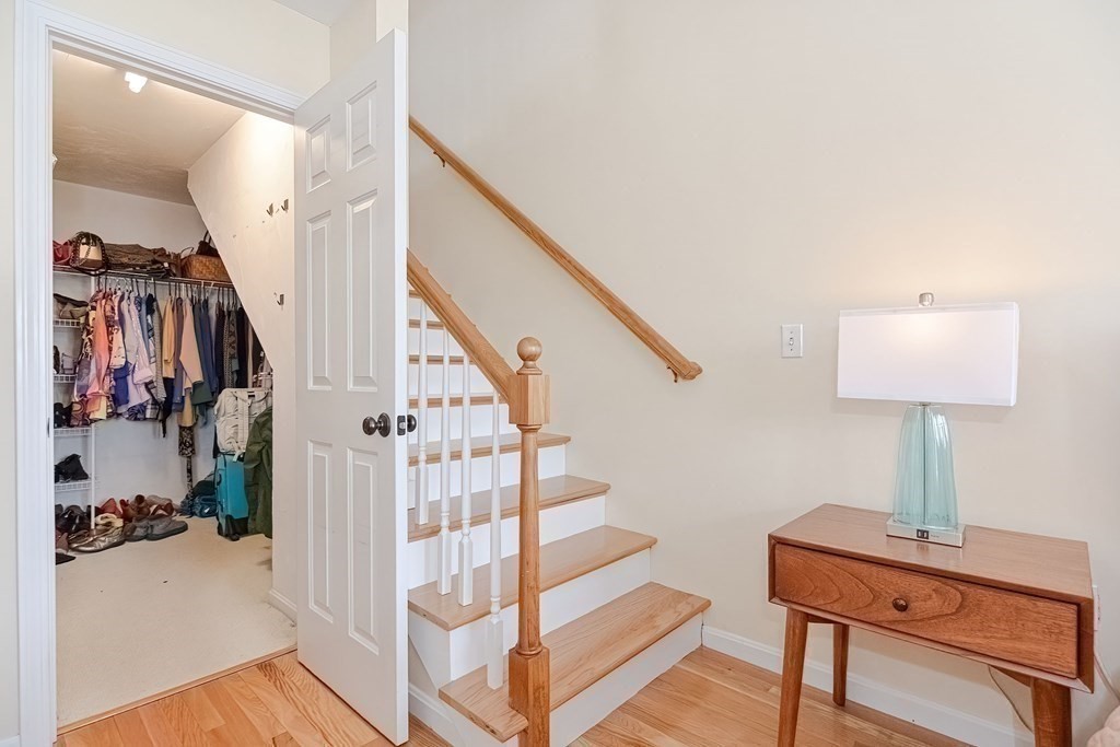 18 Carnation Circle, Unit B Reading, MA 01867 - Photo 26 of 42 a view of entryway and hall with wooden floor