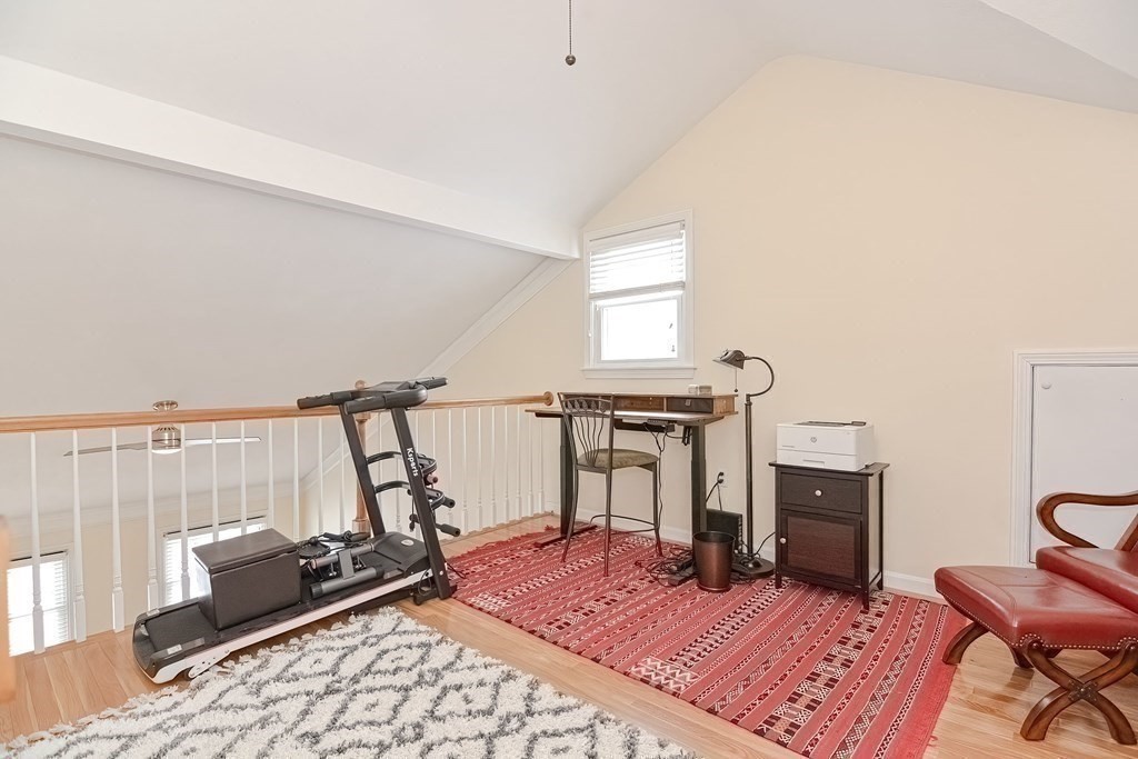18 Carnation Circle, Unit B Reading, MA 01867 - Photo 27 of 42 a living room with a couch and a table