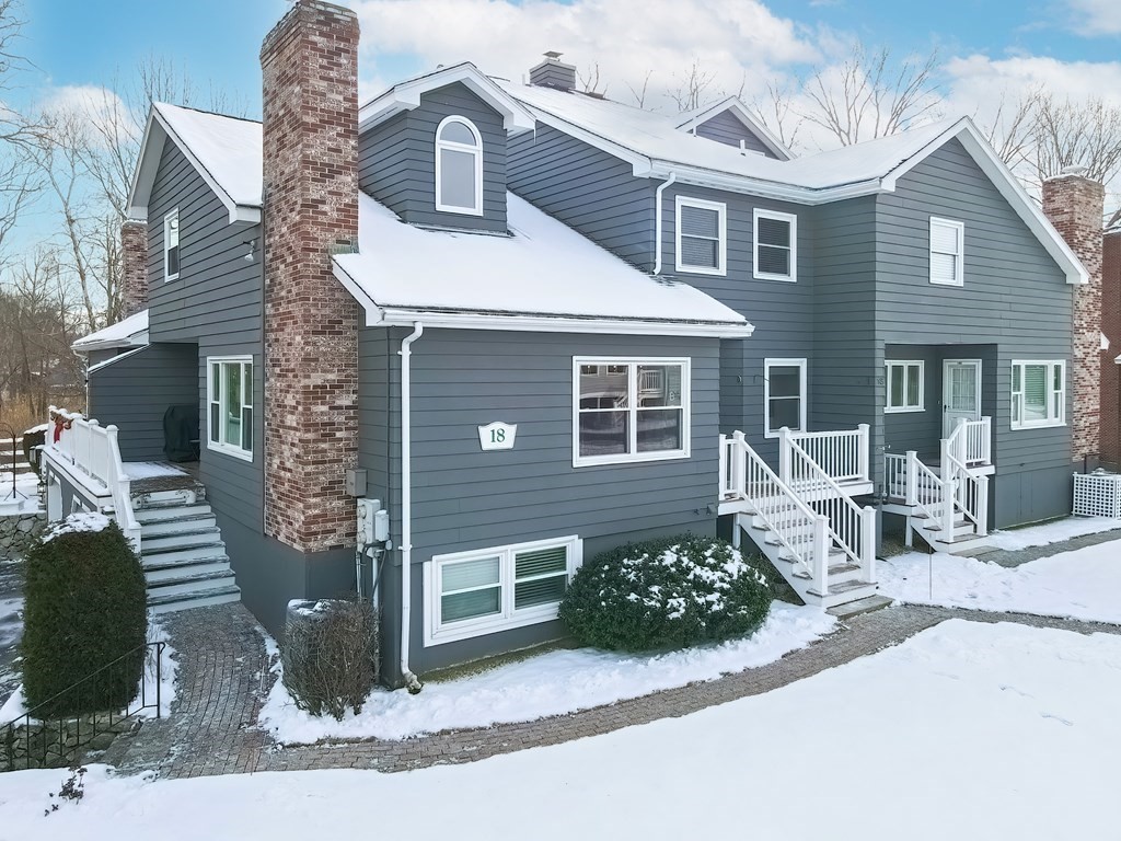 18 Carnation Circle, Unit B Reading, MA 01867 - Photo 3 of 42 a front view of a house with garden