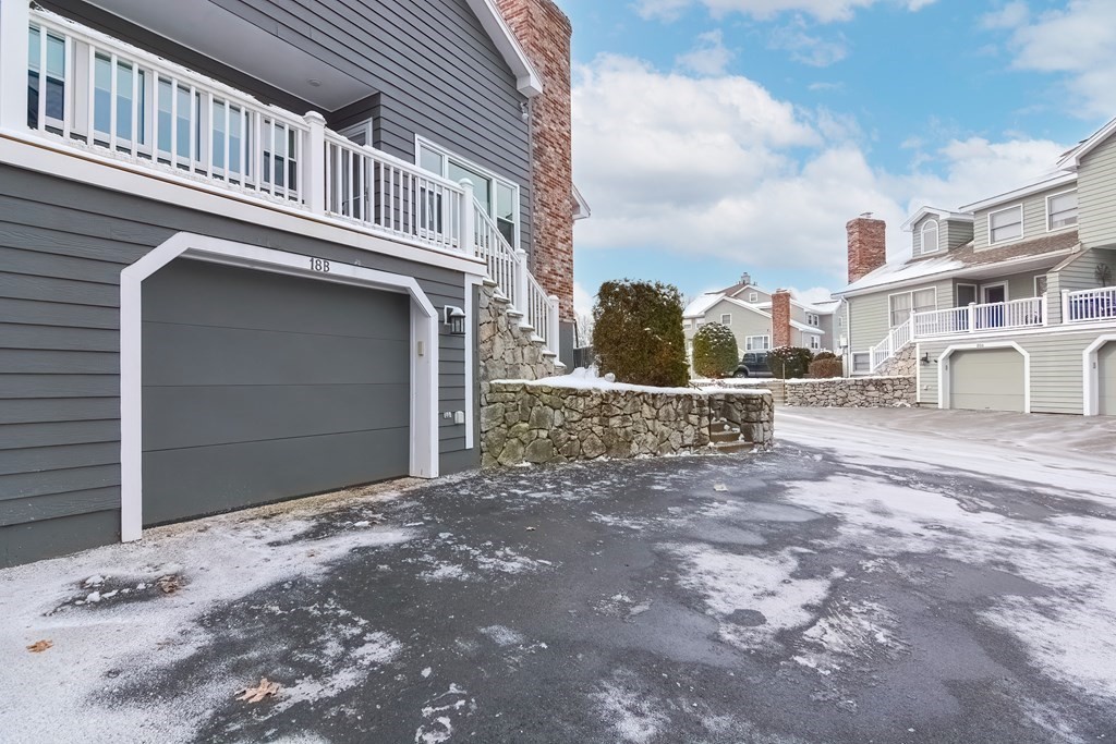 18 Carnation Circle, Unit B Reading, MA 01867 - Photo 39 of 42 a front view of a house with a yard