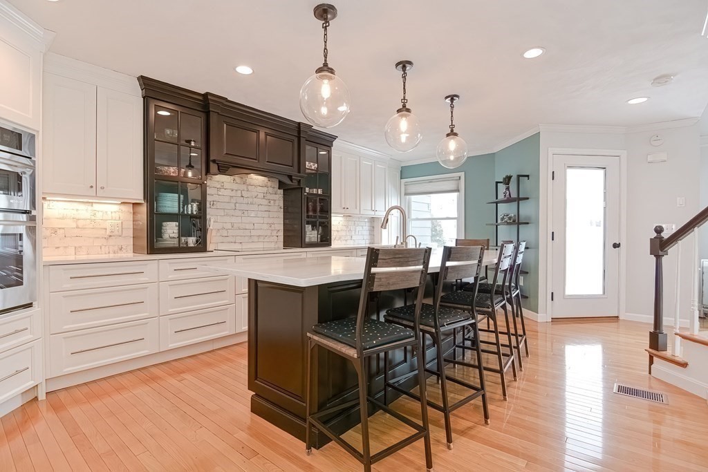 18 Carnation Circle, Unit B Reading, MA 01867 - Photo 6 of 42 a view of a dining room with furniture window and wooden floor