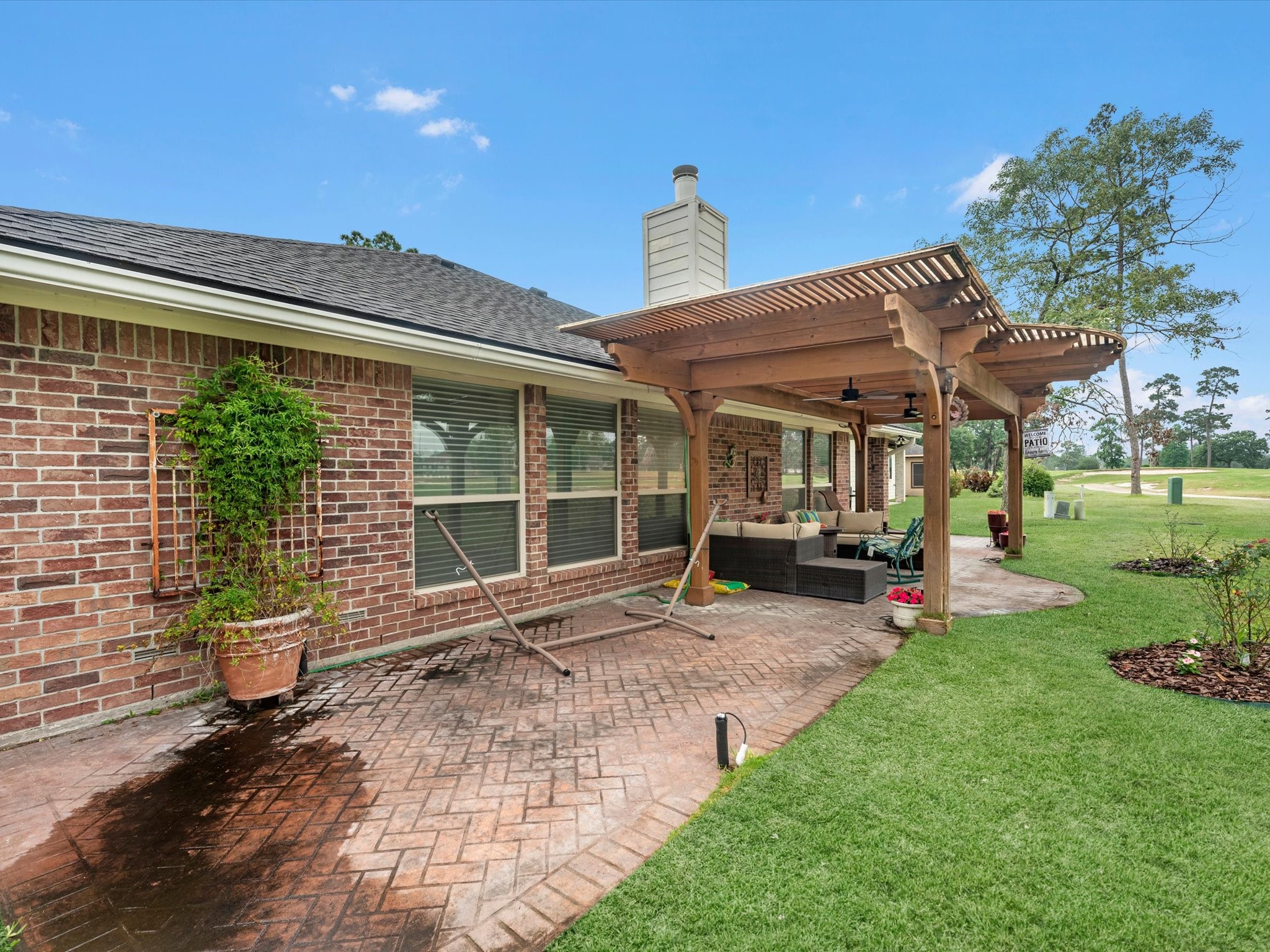 19019 Relay Road Humble, TX 77346 - Photo 30 of 31 a view of a house with backyard sitting area and garden