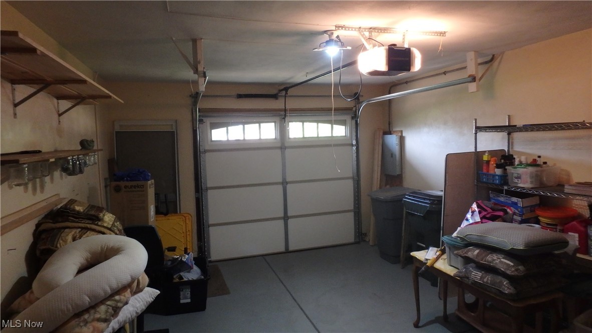 2901 Dentzler Road Parma, OH 44134 - Photo 7 of 25 Garage with a garage door opener and electric panel