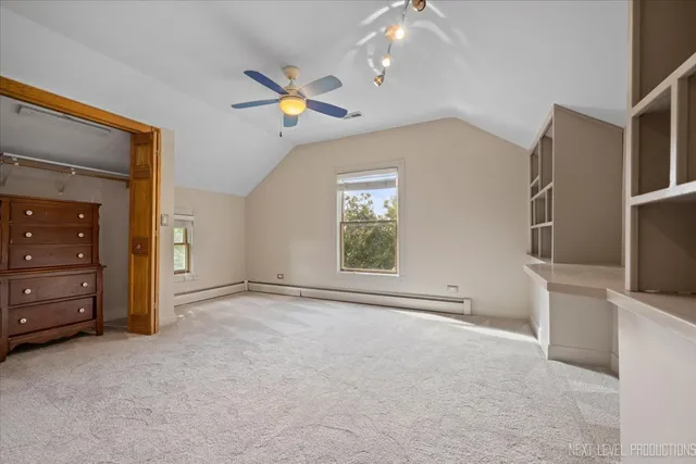 a view of an empty room with a cabinet and a flat screen tv