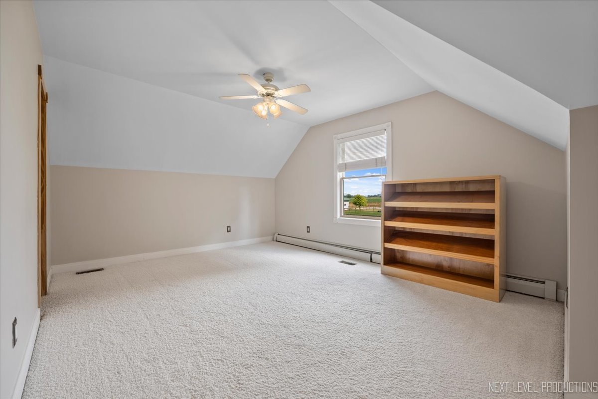 13753 McKanna Road Minooka, IL 60447 - Photo 18 of 26 a view of empty room with stairs and fan