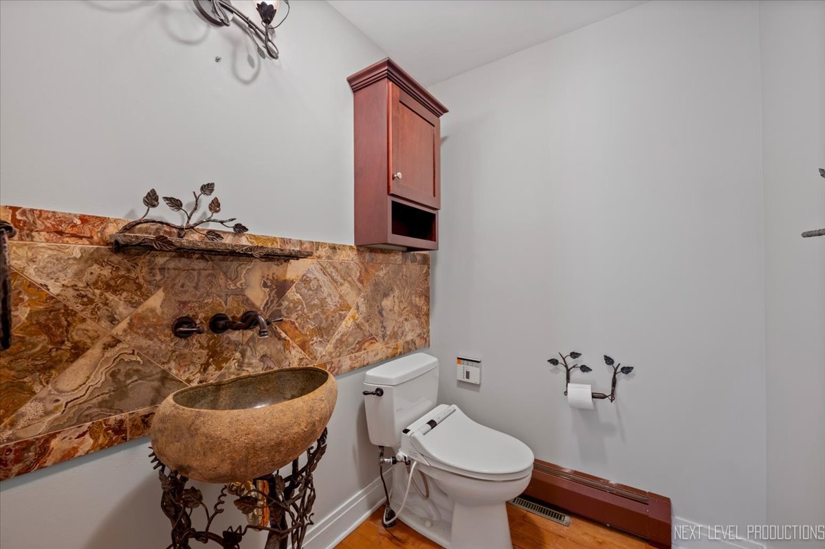 13753 McKanna Road Minooka, IL 60447 - Photo 6 of 26 a bathroom with a sink and a toilet