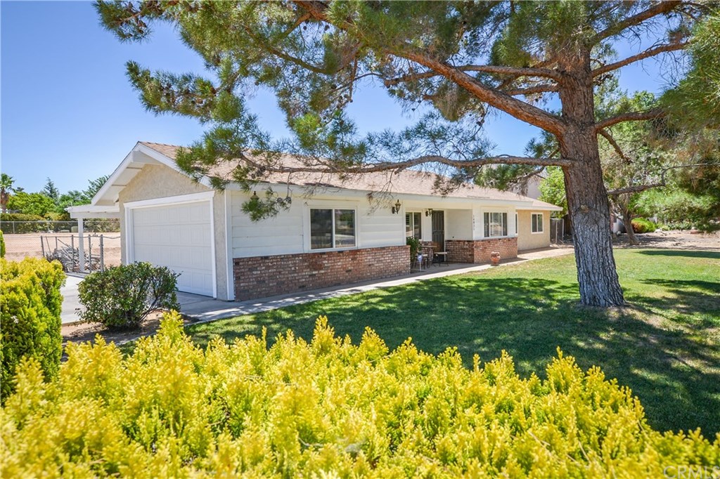 14835 Genesee Road Apple Valley, CA 92307 - Photo 1 of 1 front view of a house with a yard