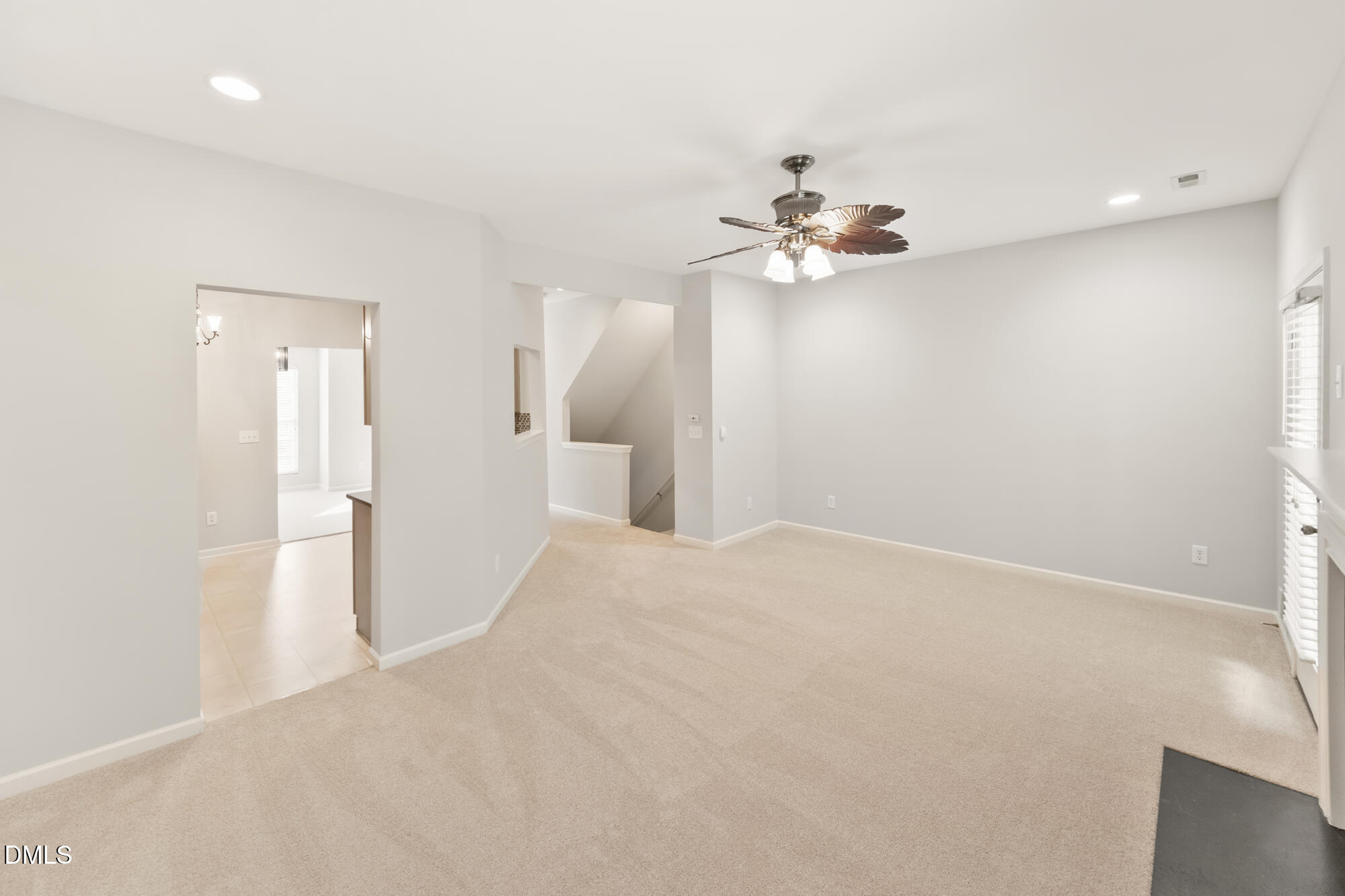 3123 Winding Waters Way Raleigh, NC 27614 - Photo 14 of 57 a view of a big room with chandelier fan