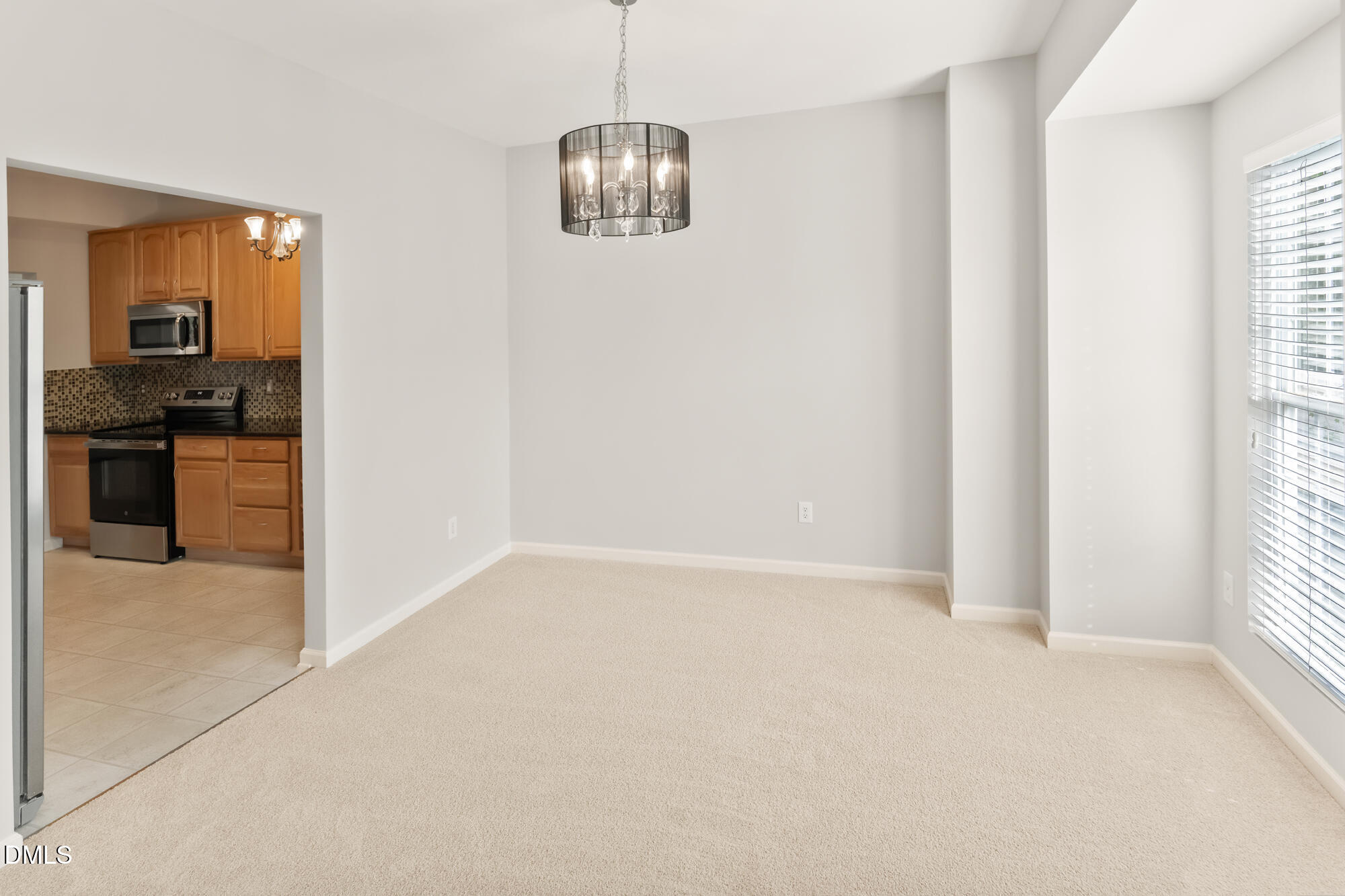 3123 Winding Waters Way Raleigh, NC 27614 - Photo 19 of 57 an empty room with windows and cabinet