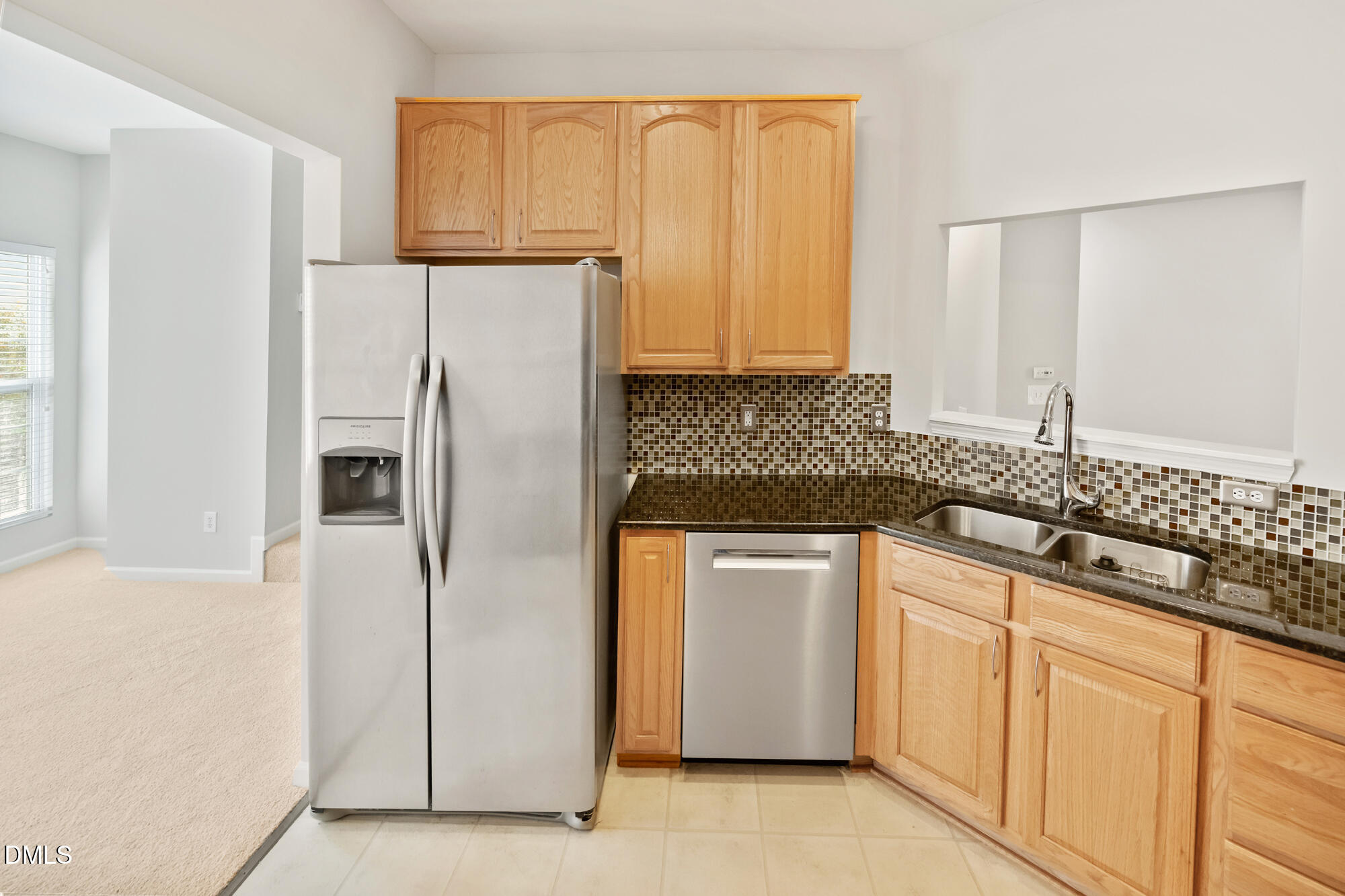 3123 Winding Waters Way Raleigh, NC 27614 - Photo 23 of 57 a kitchen with stainless steel appliances granite countertop a refrigerator and a sink