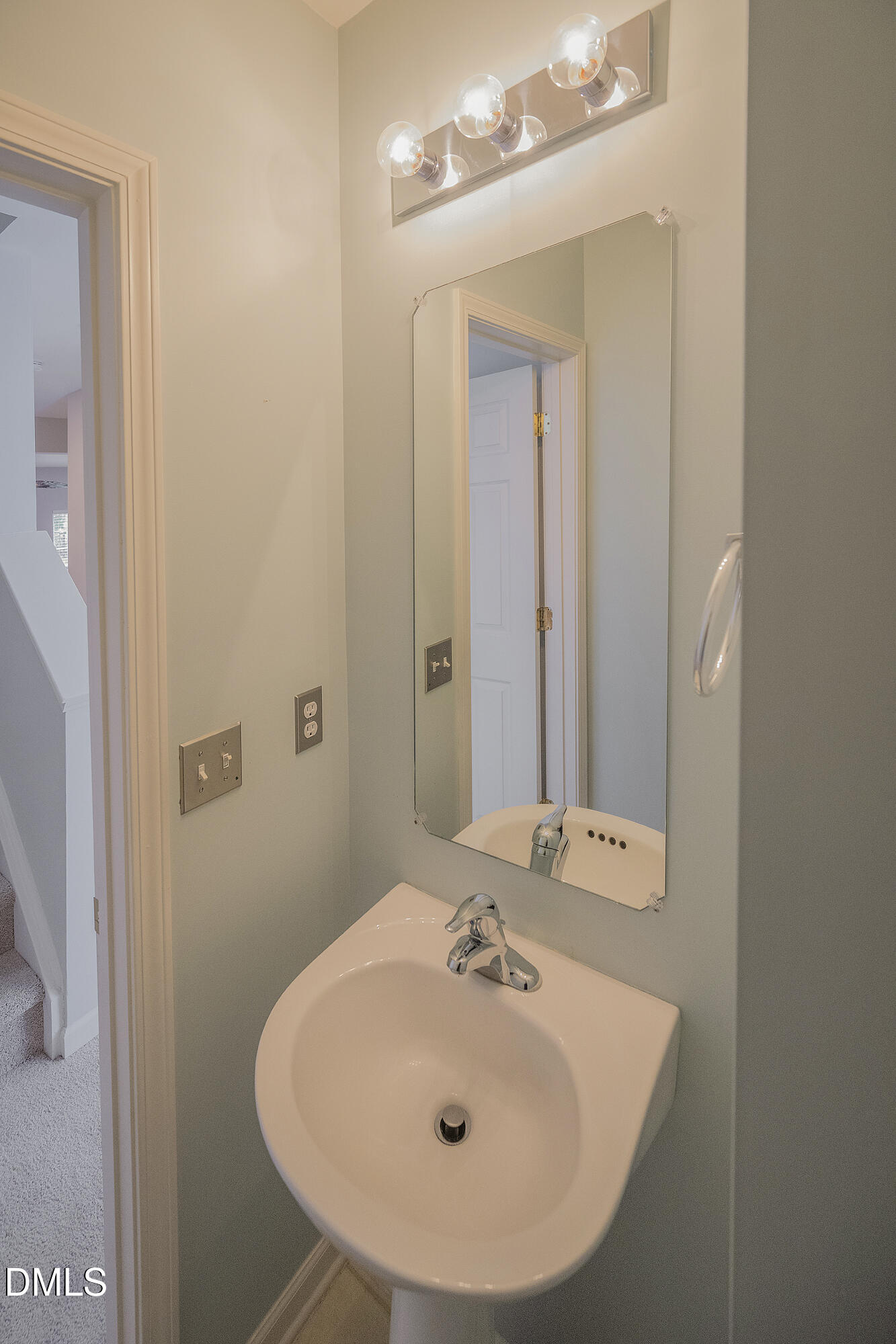 3123 Winding Waters Way Raleigh, NC 27614 - Photo 29 of 57 a bathroom with a sink and a mirror