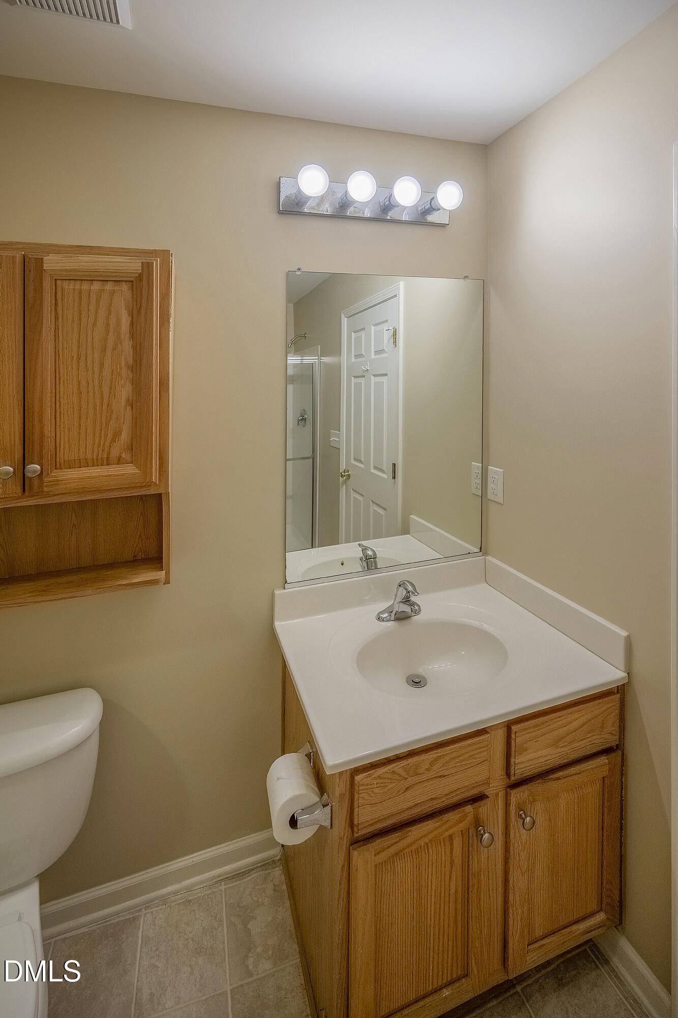 3123 Winding Waters Way Raleigh, NC 27614 - Photo 32 of 57 a bathroom with a sink and a mirror