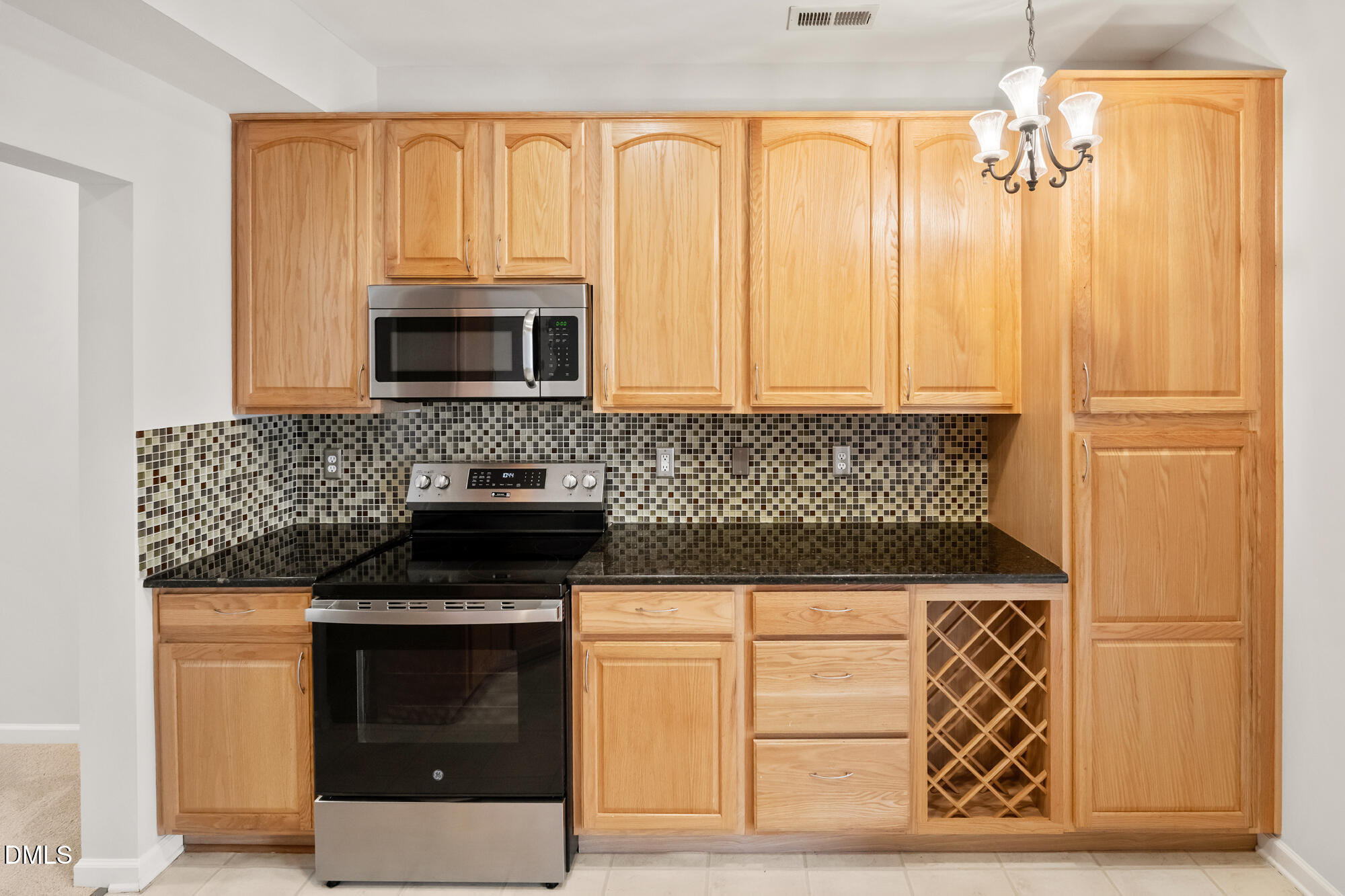 3123 Winding Waters Way Raleigh, NC 27614 - Photo 4 of 57 a kitchen with granite countertop cabinets stainless steel appliances and wooden floor