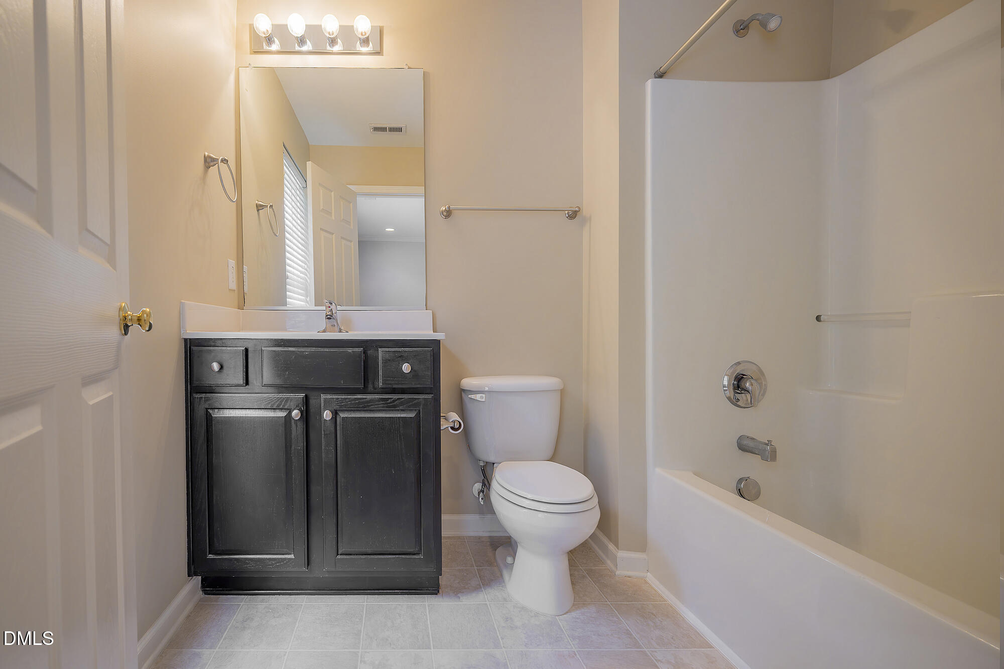 3123 Winding Waters Way Raleigh, NC 27614 - Photo 44 of 57 a bathroom with a granite countertop toilet a sink and bathtub