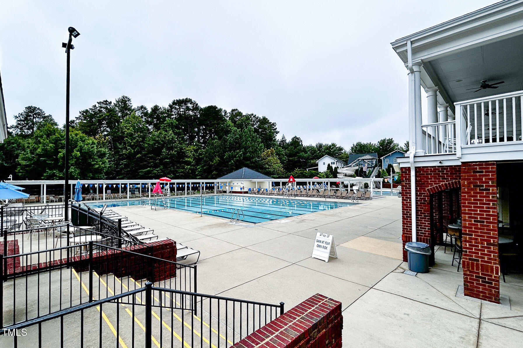 3123 Winding Waters Way Raleigh, NC 27614 - Photo 47 of 57 a view of a swimming pool with a lounge chairs