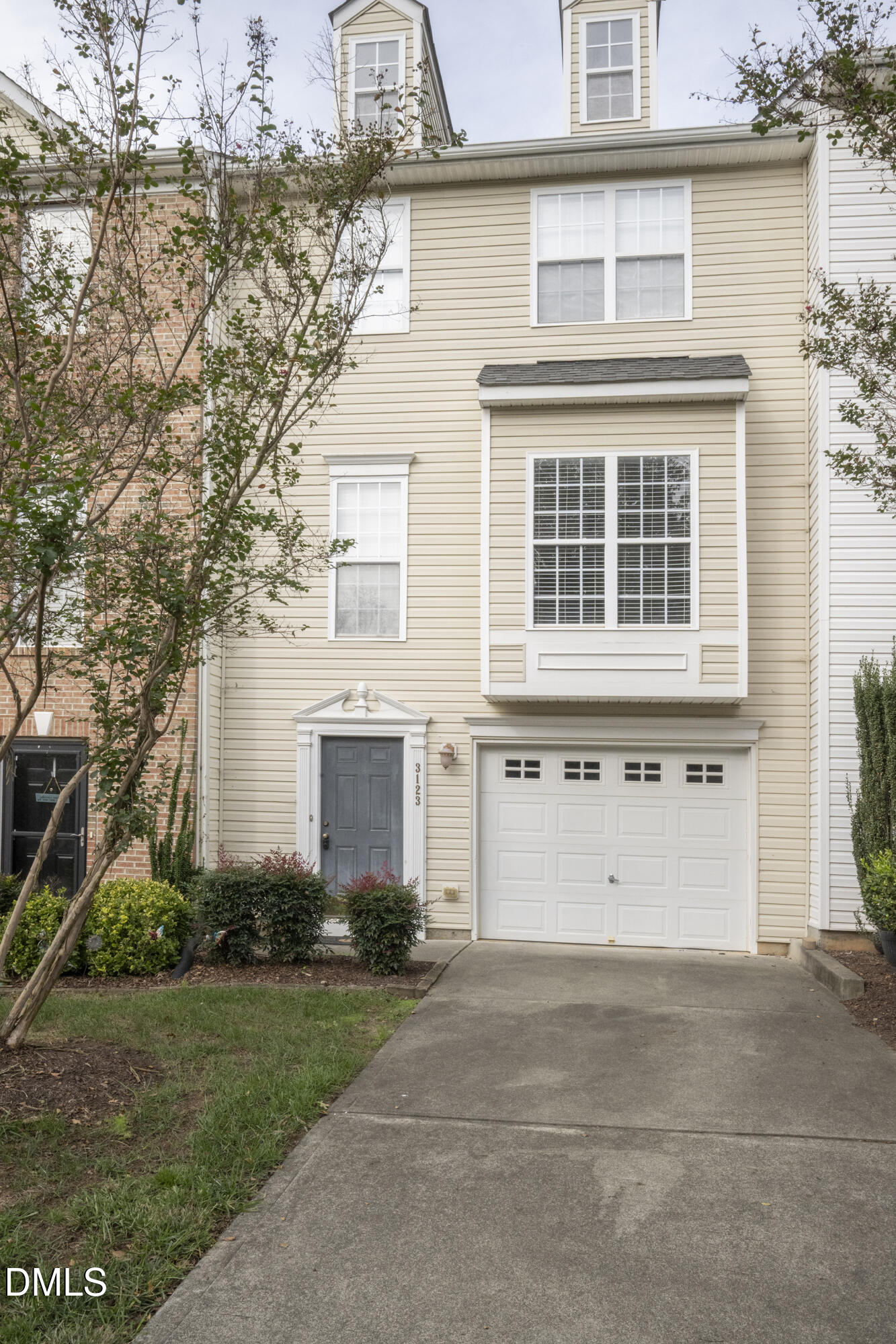 3123 Winding Waters Way Raleigh, NC 27614 - Photo 56 of 57 a front view of a house with a yard and garage