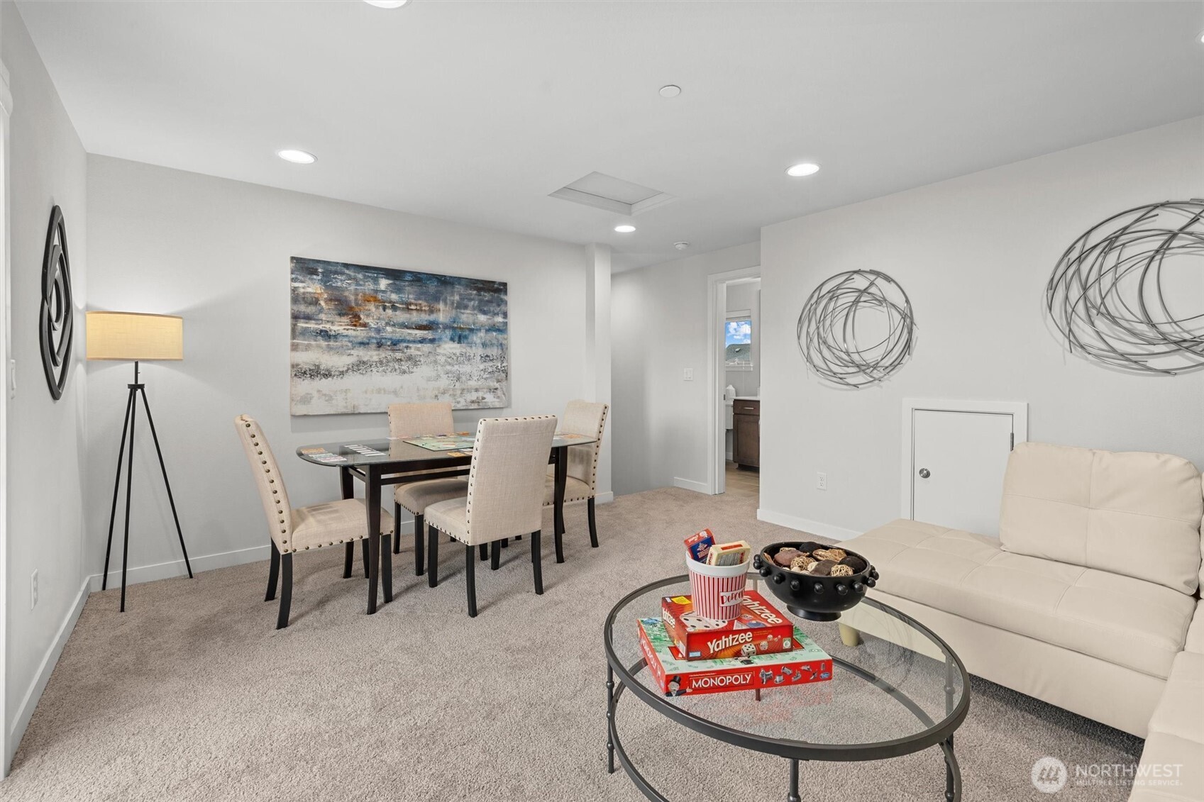 983 8th Avenue Northeast Issaquah, WA 98029 - Photo 29 of 40 a living room with furniture a clock and a flat screen tv