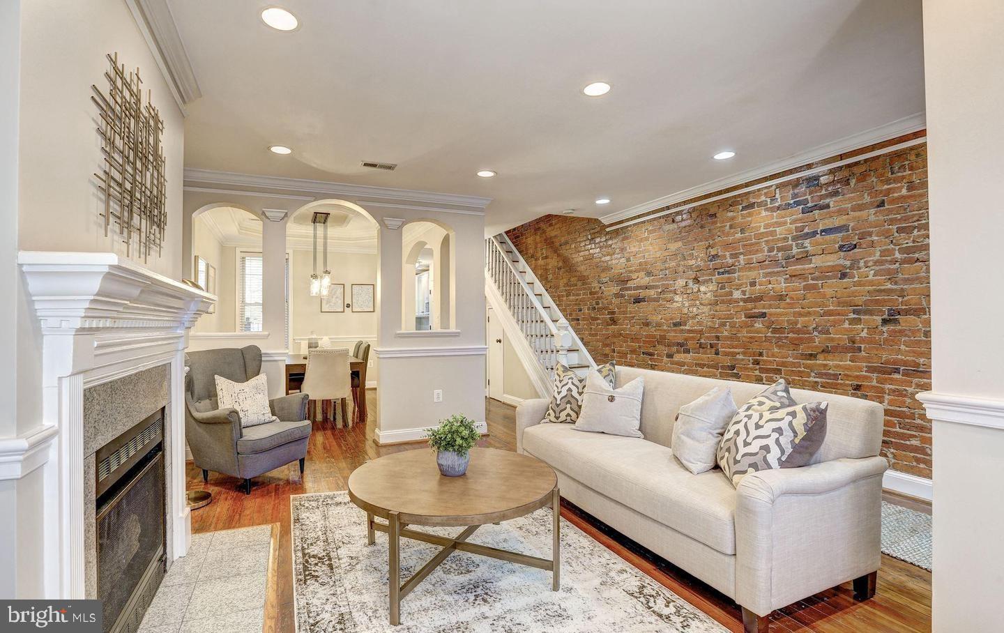 1237 I Street Northeast Washington, DC 20002 - Photo 6 of 27 a living room with fireplace furniture and a wooden floor