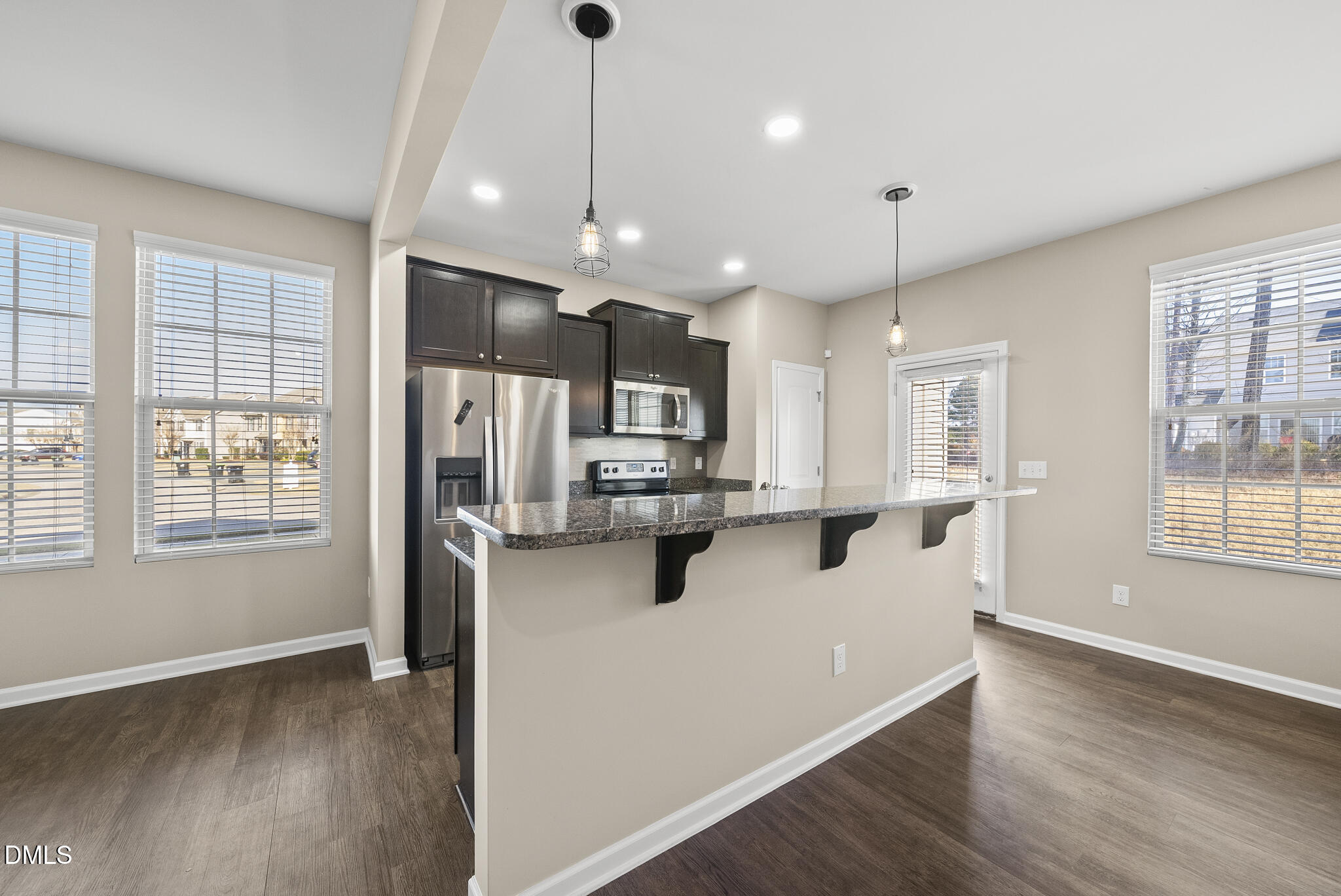 1044 Grand Ridge Drive Rolesville, NC 27571 - Photo 12 of 31 Kitchen with Island Breakfast Bar