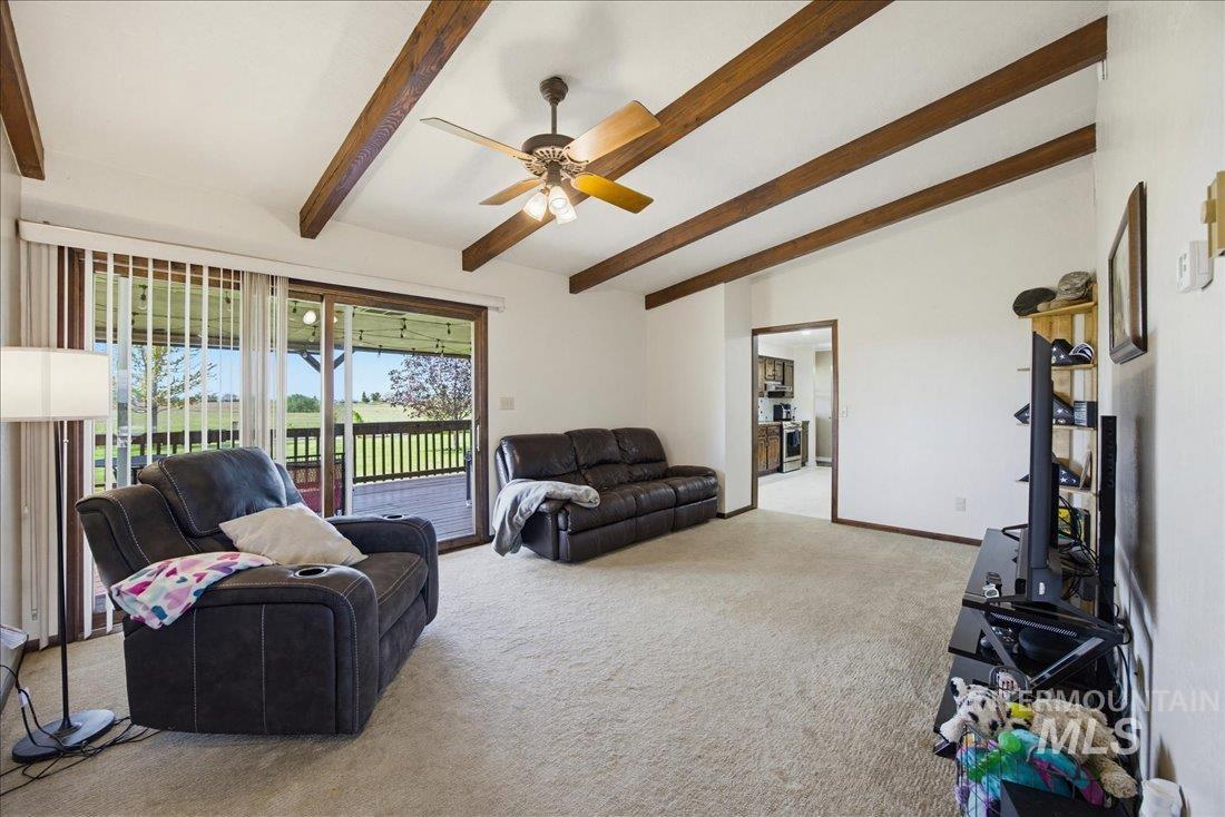 1901 South Ten Mile Road Meridian, ID 83642 - Photo 13 of 32 Vaulted ceiling with exposed wood beams and ceiling fan