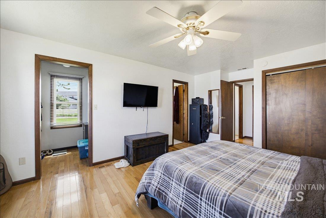 1901 South Ten Mile Road Meridian, ID 83642 - Photo 19 of 32 Hardwood flooring featured in a bright room with white walls and dark wood trim