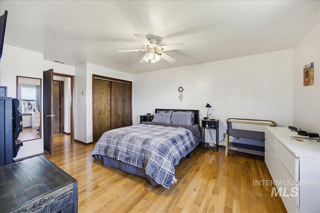 1901 South Ten Mile Road Meridian, ID 83642 - Photo 20 of 32 Hardwood-style flooring throughout this room, featuring a ceiling fan, and ample wall space