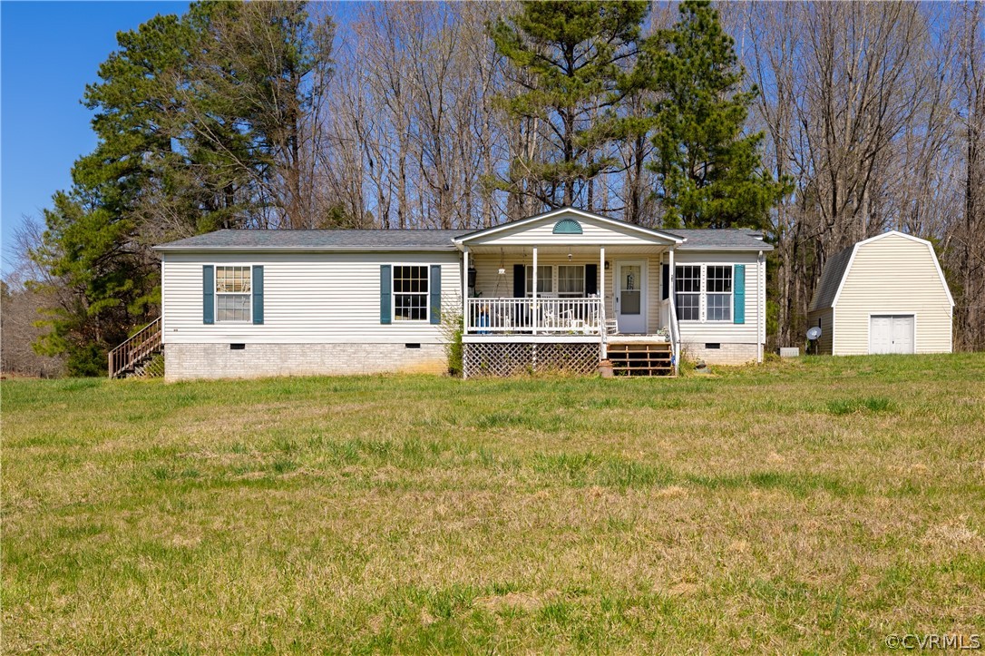 382 Fairview Road Blackstone, VA 23824 - Photo 1 of 32 a front view of a house with garden
