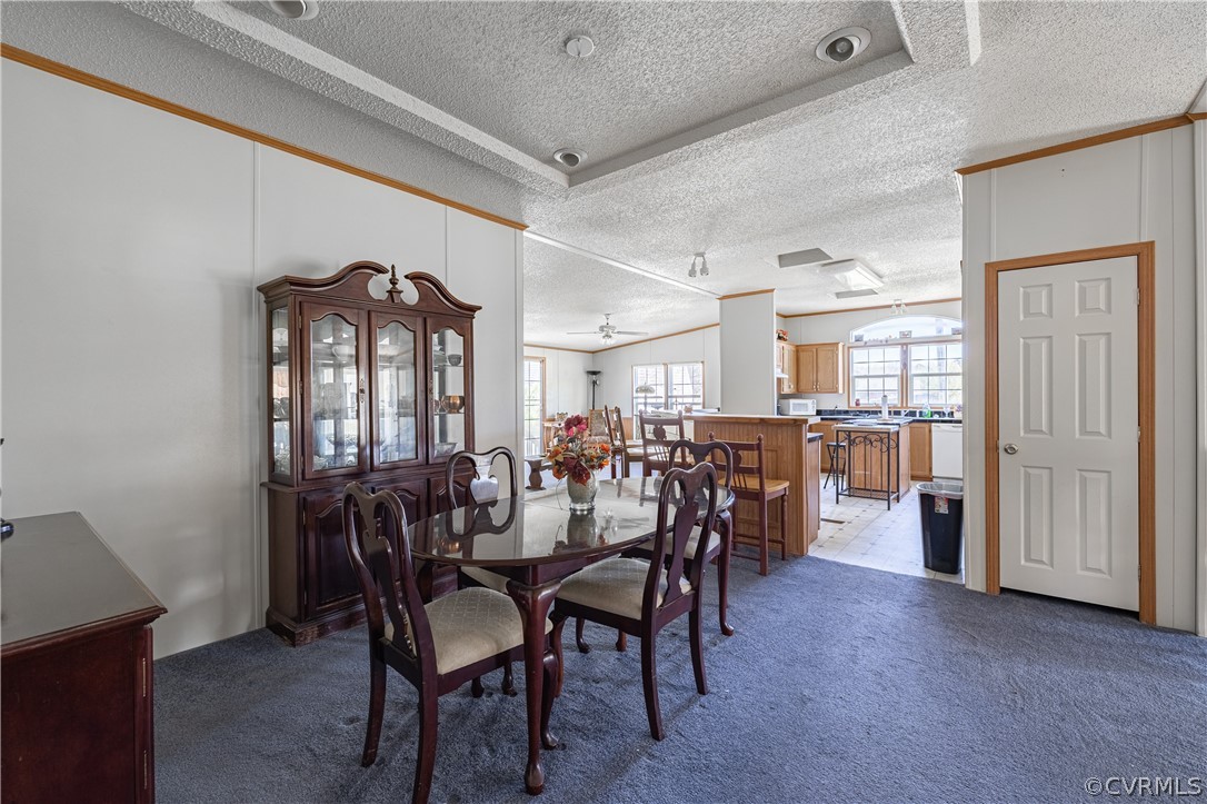 382 Fairview Road Blackstone, VA 23824 - Photo 7 of 32 a view of a dining room with furniture and a chandelier