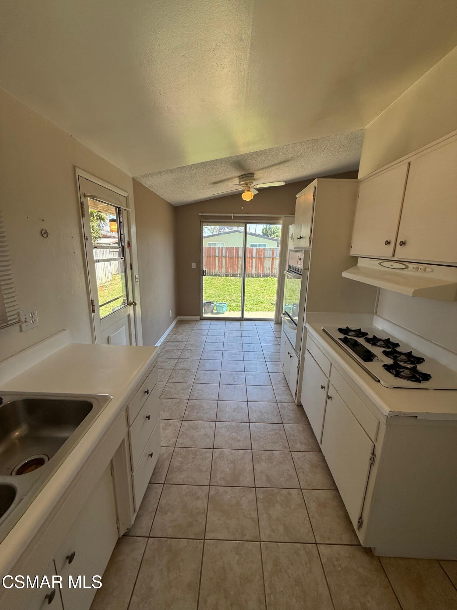 1482 Paul Street Simi Valley, CA 93065 - Photo 6 of 12 a kitchen with a sink a stove and cabinets