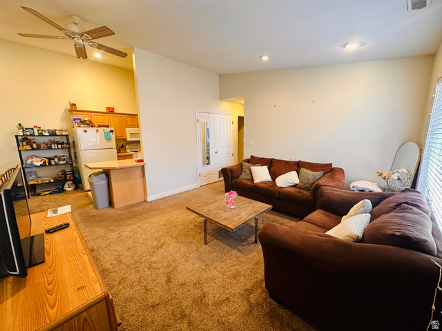 1559 Riverside Avenue, Unit 9 Provo, UT 84604 - Photo 2 of 12 Living room with light carpet, a ceiling fan, vaulted ceiling, and recessed lighting