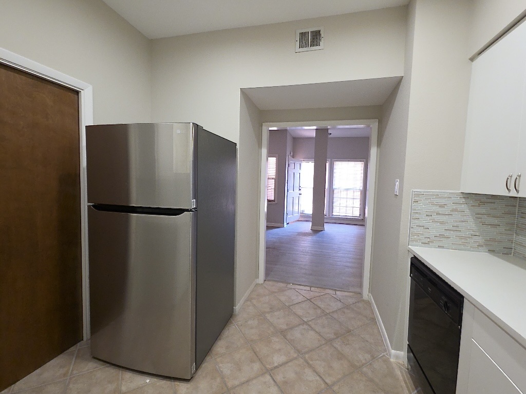 3200 Duval Street, Unit 102 Austin, TX 78705 - Photo 11 of 20 a view of a kitchen from the hallway