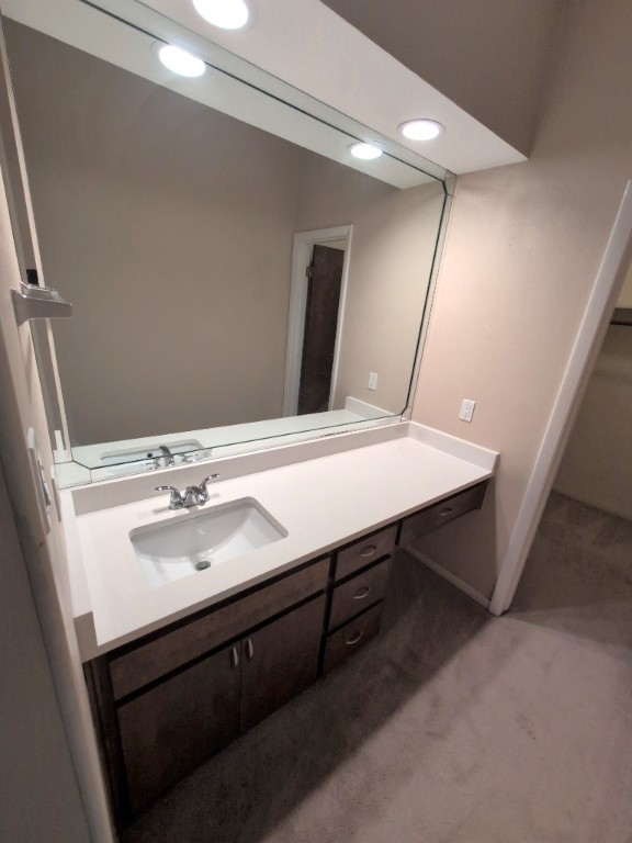3200 Duval Street, Unit 102 Austin, TX 78705 - Photo 13 of 20 a bathroom with a sink and a mirror