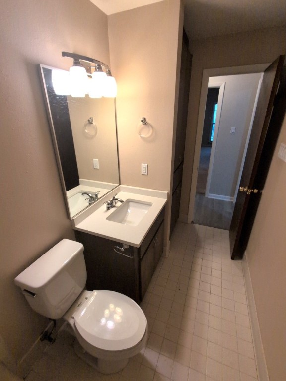 3200 Duval Street, Unit 102 Austin, TX 78705 - Photo 17 of 20 a bathroom with a sink mirror and toilet