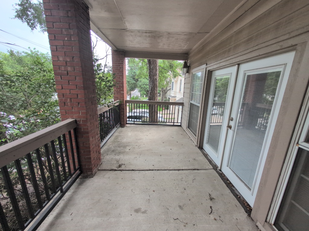 3200 Duval Street, Unit 102 Austin, TX 78705 - Photo 19 of 20 a view of a porch with wooden floor and outdoor space