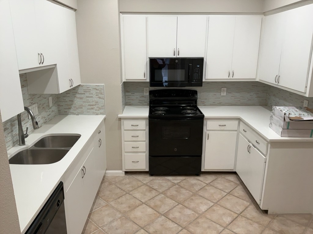 3200 Duval Street, Unit 102 Austin, TX 78705 - Photo 9 of 20 a kitchen with a sink and a stove top oven