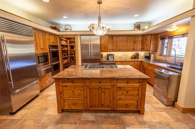 a kitchen with a refrigerator a sink and dishwasher
