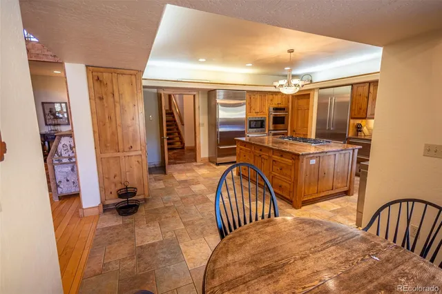 a view of a bedroom with furniture and workspace