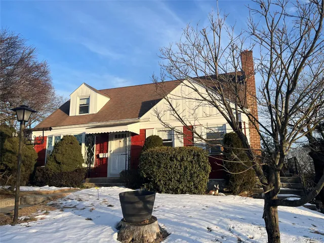 a view of house with yard