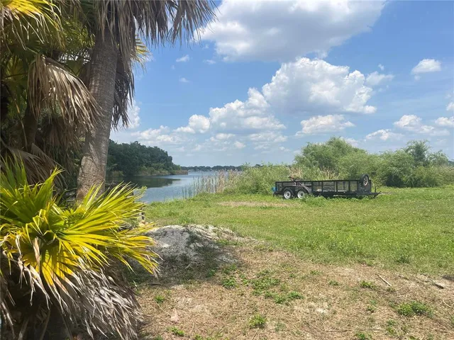 a view of a lake with a big yard