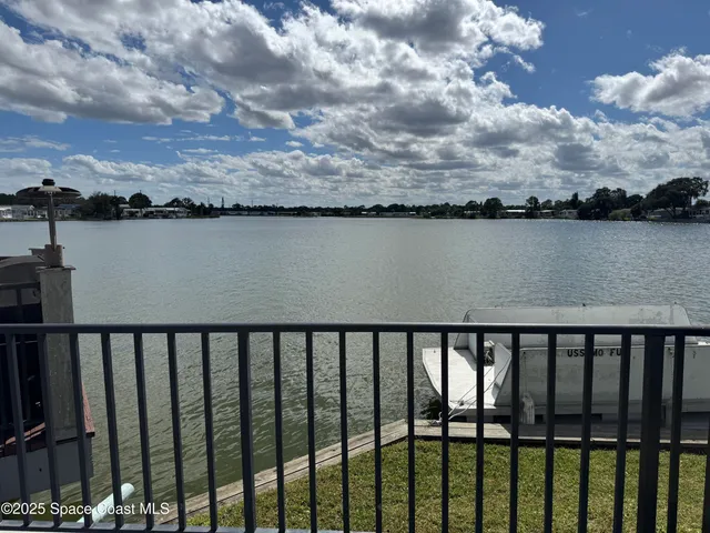 a view of swimming pool from a balcony