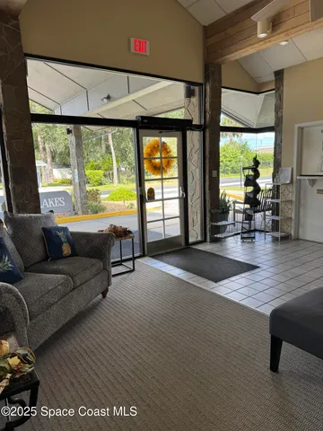 a outdoor space with lots of furniture and wooden floor