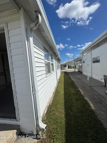 a view of a backyard of the house