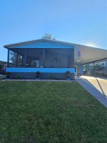 a view of yard with swimming pool and yard