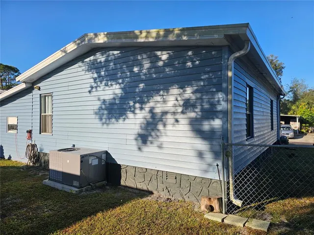 a view of a house with swimming pool yard and sitting area