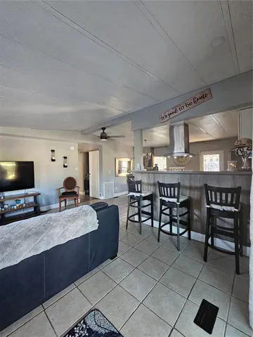 a large kitchen with a table and chairs
