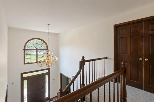 a view of a entryway door with wooden floor